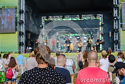 Couple is watching concert at open air music festival Editorial Stock Photo
