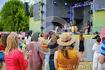 Couple is watching concert at open air music festival Editorial Stock Photo
