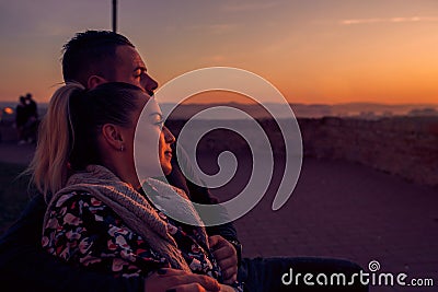 Couple watching at evening the sunset Stock Photo