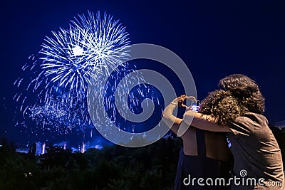 Couple watching fireworks show Stock Photo