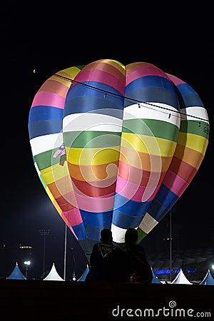 A couple are watching Hot air balloon in Johor Bahru Editorial Stock Photo