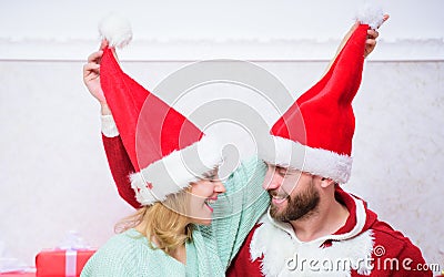 Couple wear hats as santa claus christmas tree background. It is easy to spread happiness around. Happy family celebrate Stock Photo