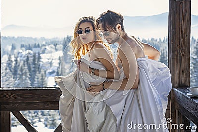 couple in winter in blankets Stock Photo