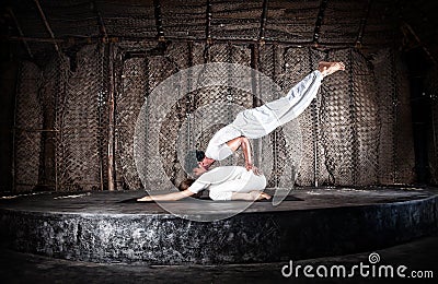 Couple yoga in hall Stock Photo