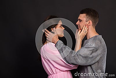 A couple of young actors on a dark background Stock Photo