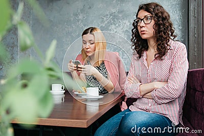 Couple of young attractive women girlfriends in a quarrel Stock Photo