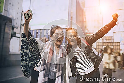 Couples of asian traveller happiness emotion at dotonbori most popular traveling destination in osaka japan Stock Photo