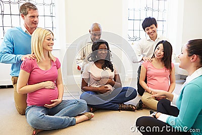 Couples Attending Ante Natal Class Together Stock Photo