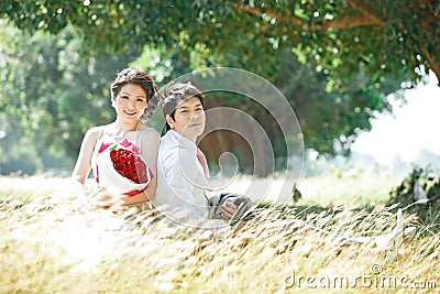 Couples on grass Stock Photo