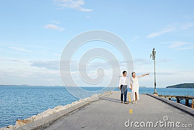 Couples showing love and happy to travel anywhere. Stock Photo