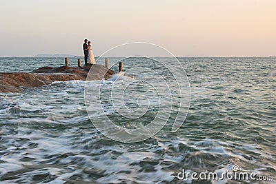 Couples Taking Wedding Photos At Seaside Editorial Stock Photo