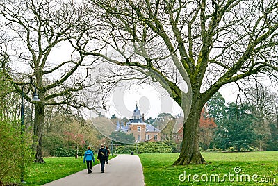 Couples walking in a park on a cloudy spring day Stock Photo