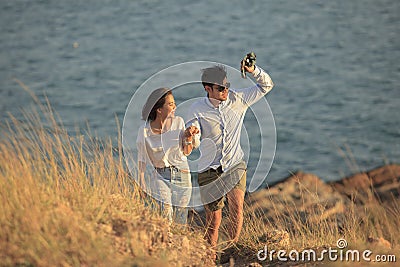 Couples of younger man and woman in love relaxing vacation outdo Stock Photo