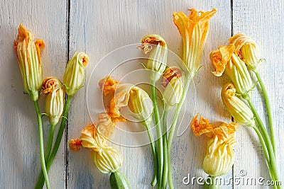 Courgette flowers on wooden background Stock Photo
