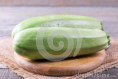 Courgettes zucchini on cutting board Stock Photo