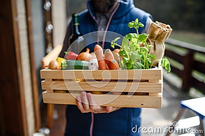 Courier delivering fresh fruit and vegetables shopping, corona virus and quarantine concept. Stock Photo