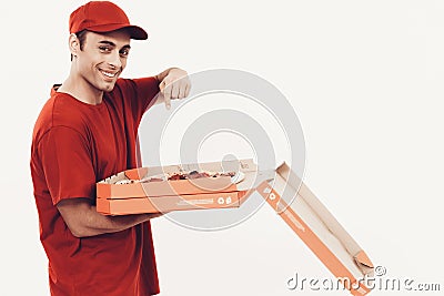 Smiling Arab Deliveryman with Opening Pizza Box. Stock Photo