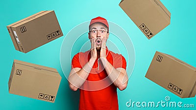 Courier has a wondered expression about a great promotion with falling packages. cyan background Stock Photo