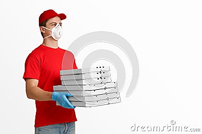 Courier holds many pizza boxes on white background Stock Photo