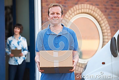 Courier Making Delivery To Client Office Stock Photo