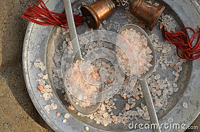 Course pink Himalayan salt on pewter plate and pewter spoons Stock Photo