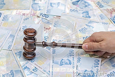 Court gavel on money background. Turkish lira money and judges gavel on table. Judgement and bribe. corruption Stock Photo