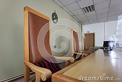 Court hall room justice chairs judgement background Stock Photo