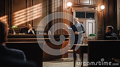 Court of Law Trial in Session: Portrait of Charismatic Male Public Defender Making Touching Stock Photo