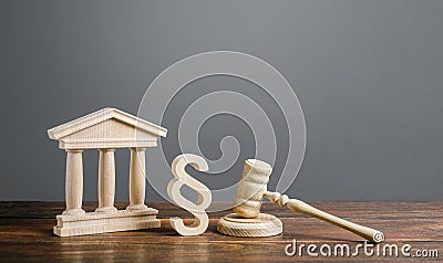 Courthouse, gavel and a paragraph symbol. International Court. Protection of business interests and human rights. intellectual Stock Photo