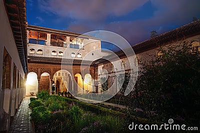 Courtyard of the Canal (Patio de la Acequia) at Generalife Palace of Alhambra at night - Granada, Andalusia, Spain Editorial Stock Photo