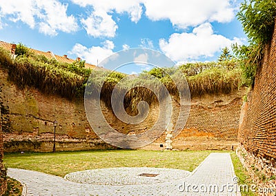 Courtyard of castle with tall brick walls Stock Photo