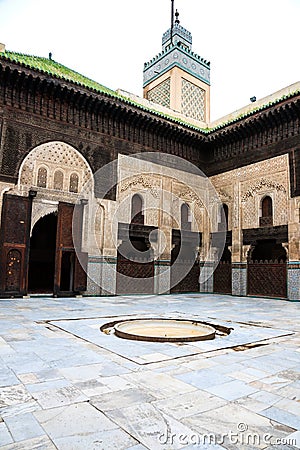 Courtyard and minaret of bou inania madrasa Stock Photo