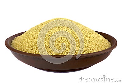 Couscous into a bowl isolated in white background Stock Photo