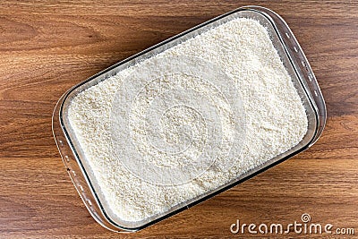 Couscous bowl, typical Brazilian dish, made with tapioca, milk, sugar and coconut milk Stock Photo