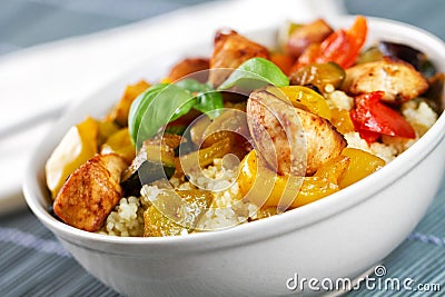 CousCous Bowl whit Meat and Mixed Grilled Vegetables Stock Photo