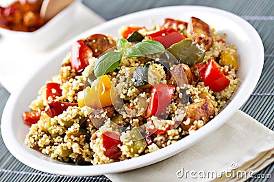 CousCous Bowl whit Meat and Mixed Grilled Vegetables Stock Photo