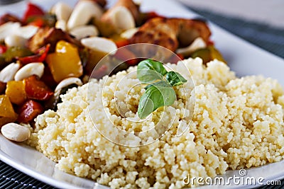 CousCous Bowl whit Meat and Mixed Grilled Vegetables Stock Photo