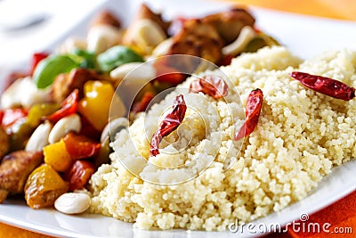 CousCous Bowl whit Meat and Mixed Grilled Vegetables Stock Photo