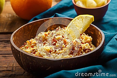 Couscous masfouf with dried fruits and nuts on a blue napkin. Stock Photo