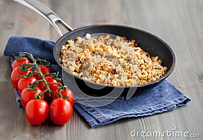 Couscous with vegetables, light healthy dietary vegan dish on a wooden table Stock Photo