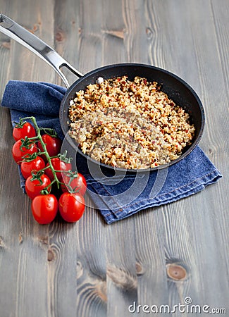 Couscous with vegetables, light healthy dietary vegan dish on a wooden table Stock Photo