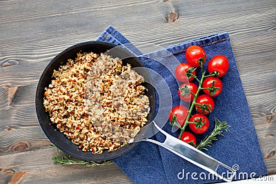 Couscous with vegetables, light healthy dietary vegan dish on a wooden table Stock Photo