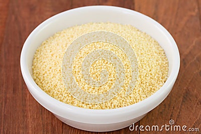 Couscous in white bowl Stock Photo