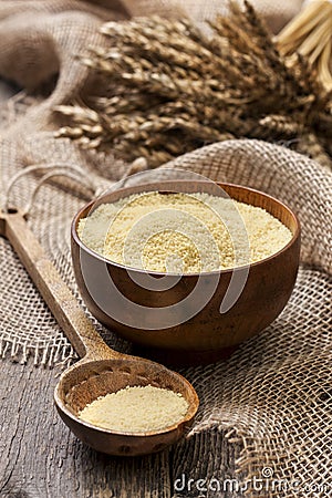 Couscous in a wooden bowl Stock Photo