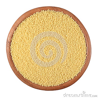 Couscous in a wooden bowl on a white Stock Photo