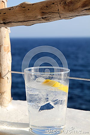 Gin tonic, Cova d en Xoroi, cove in Cala en Porter, Minorca, Balearic islands, Spain Stock Photo