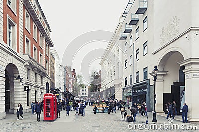 Covent Garden, a popular shopping and tourist site with historical buildings, theatres and entertainment facilities in London Editorial Stock Photo