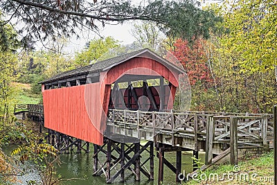 Covered Bridge Over Pond Stock Photo