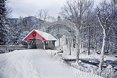 Covered bridge snowfall in rural New Hampshire Stock Photo