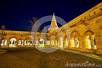 The covered corridors of the defensive bastion courtyard of Fisherman`s Bastion at night, Budapest, Hungary Stock Photo